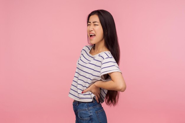 Portrait of asian young woman on pink background