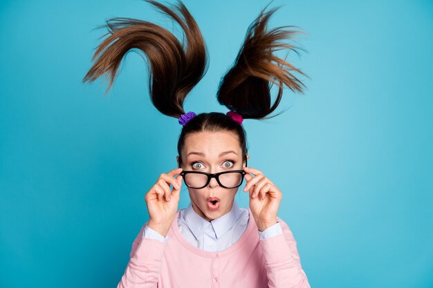 Photo portrait of astonished girl touch hands spectacles impressed