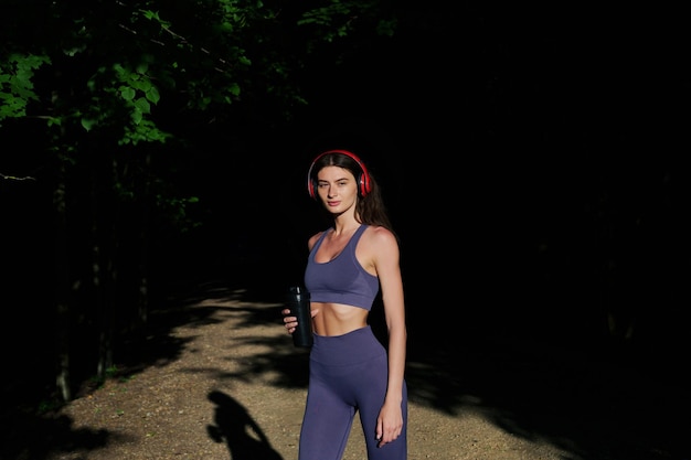 Portrait of an athlete A young woman in a tracksuit after jogging outside