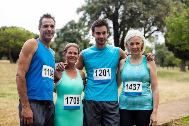 Portrait of athletes standing in park