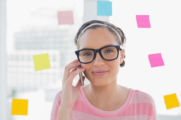 Portrait of attractive artist talking on phone