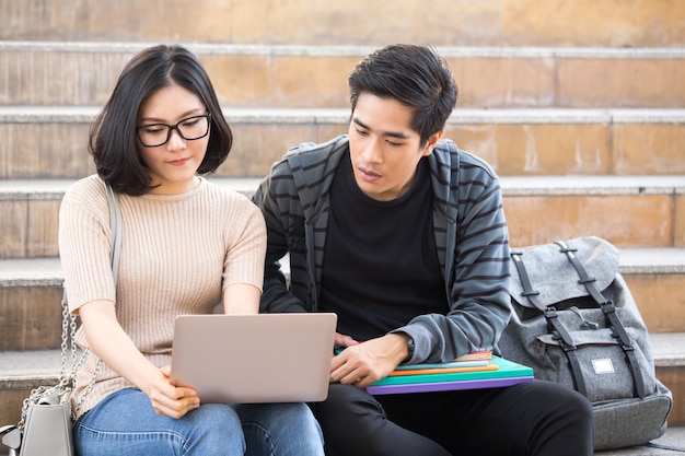 Portrait of Attractive Asian Student Pople sitting at outdoor place