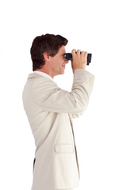 Photo portrait of an attractive businessman with binoculars