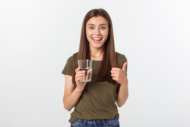 portrait of attractive caucasian smiling woman drinking water.