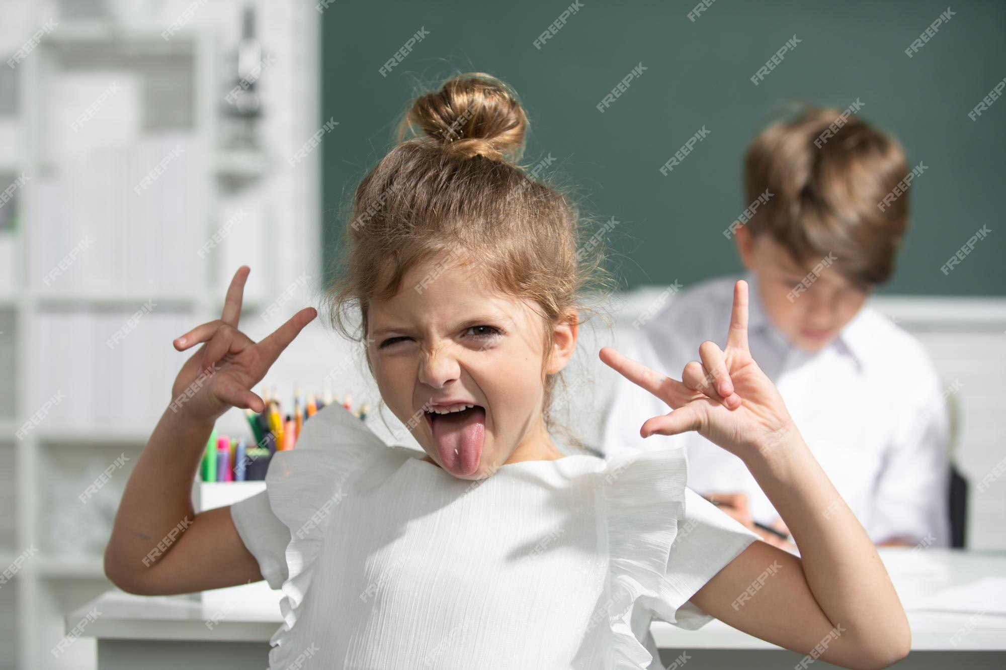 Premium Photo | Portrait of attractive crazy funny girl in class at elementary school Premium Photo | Portrait of attractive crazy funny girl in class at elementary school