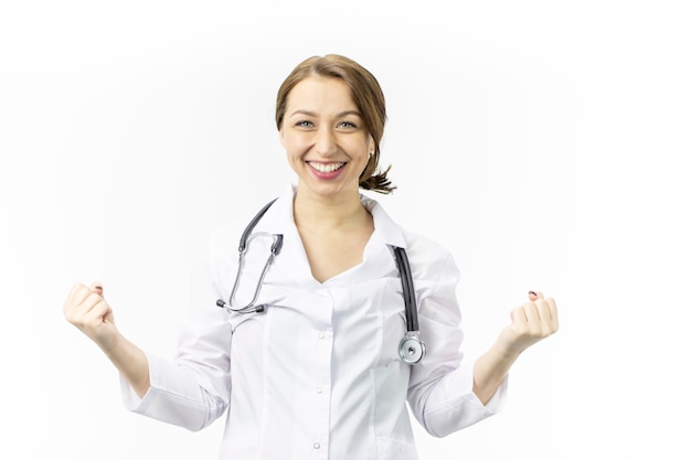 Portrait of an attractive female doctor. The joy of victory on white