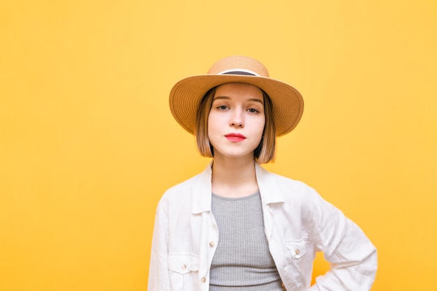 Portrait of attractive girl on orange background Copy space