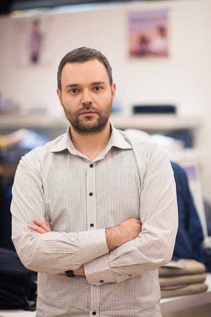 Portrait of an attractive man Shopping In A Man's Clothing Store