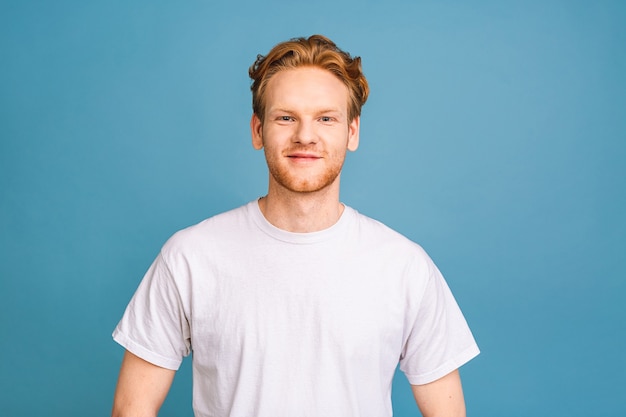 portrait of attractive red-haired caucasian young man wearing casual