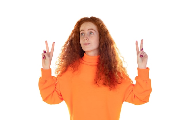 Portrait of attractive successful lucky redhaired girl rejoicing having fun