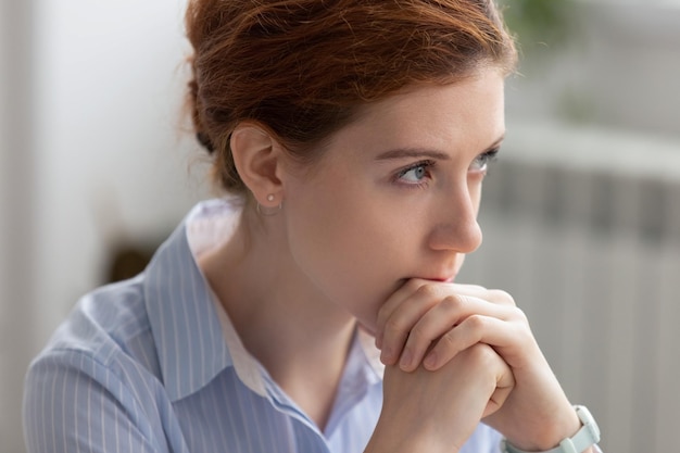 portrait of attractive thoughtful businesswoman planning thinking about solving problem