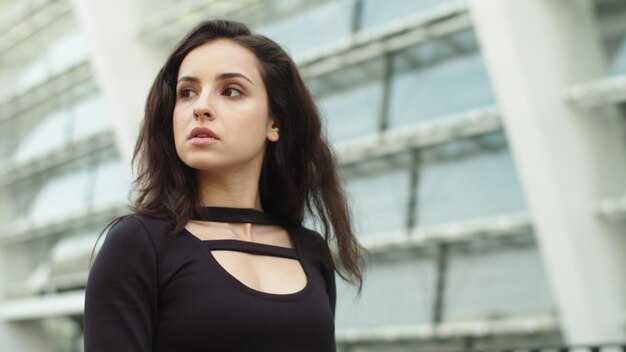 Portrait attractive woman walking at street Woman taking on sunglasses outdoor