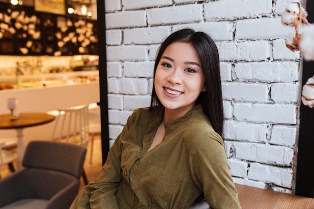 Portrait of an attractive young asian woman sitting