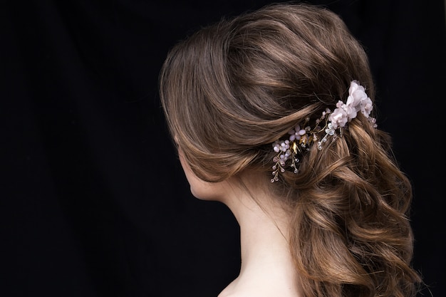 Portrait of an attractive young woman with a wedding hairstyle.