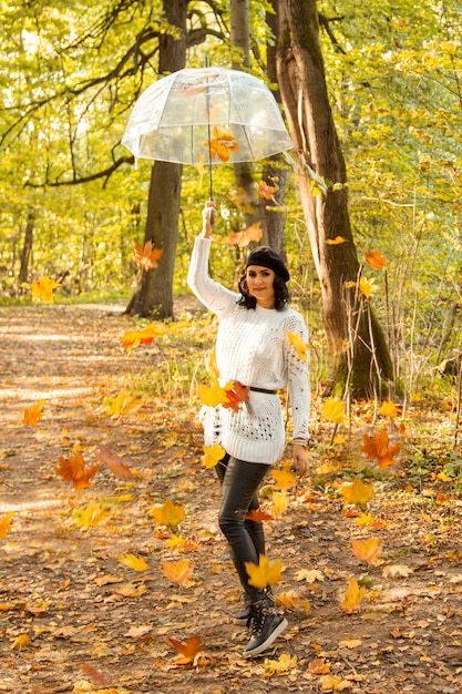 Portrait of autumn girl with leaves