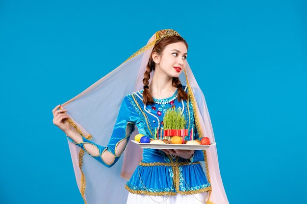 portrait of azeri woman in traditional dress with xonca blue wall spring ethnic novruz