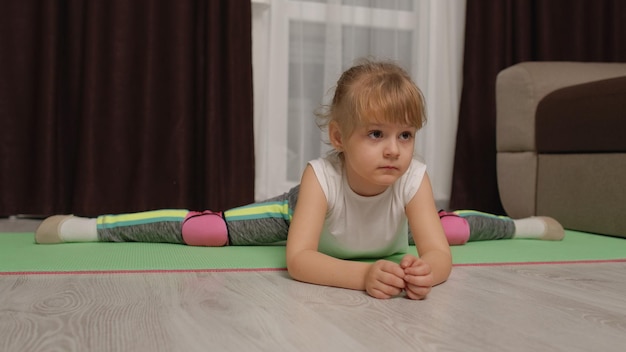 portrait of baby boy sitting on floor at home