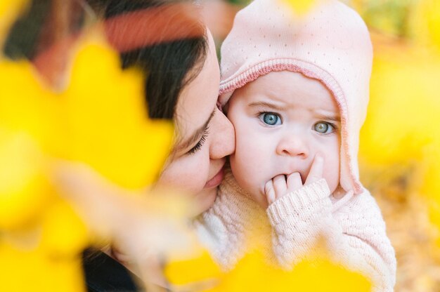 Portrait of baby girl with mother at park