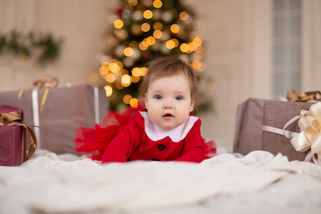 Portrait of baby near Christmas tree