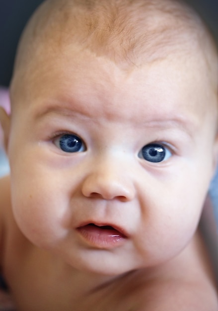 Portrait of a baby with blue eyes close-up