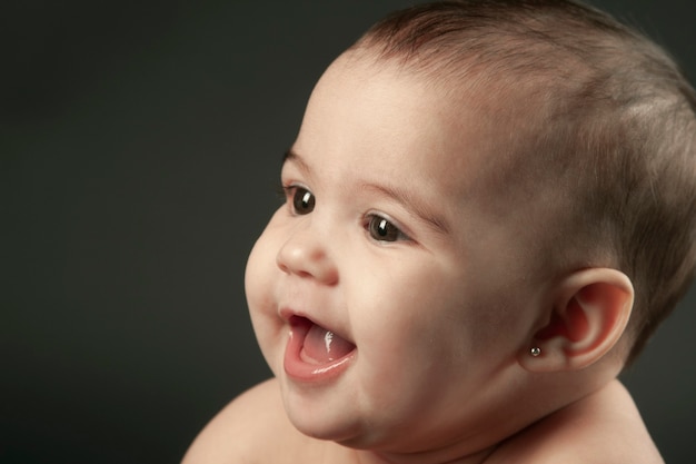 Portrait of baby with dark background