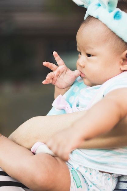 portrait of baby with mother with gradient 