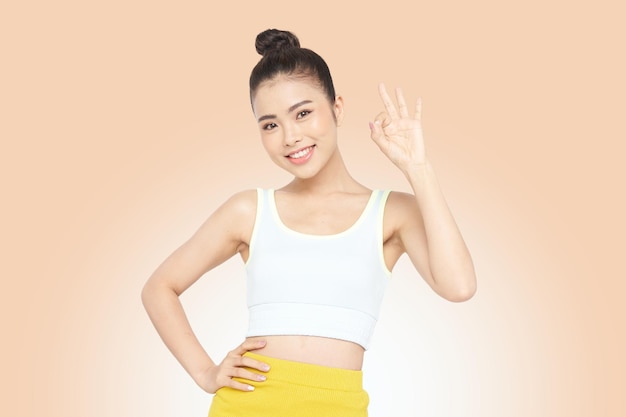 Portrait banner of a young Asian with hand gesture, isolated on background