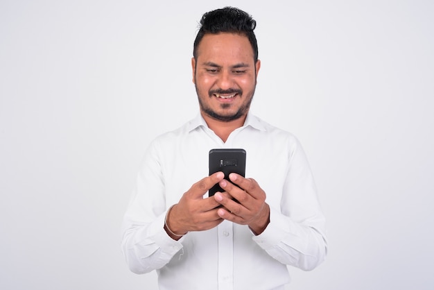 portrait of bearded Indian businessman on white