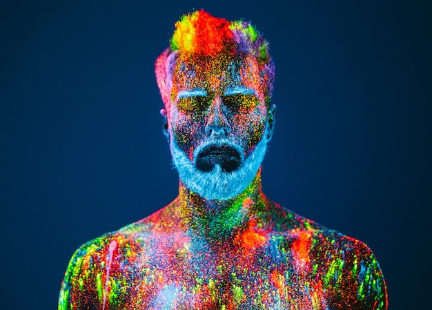 Portrait of bearded man with ultraviolet powder