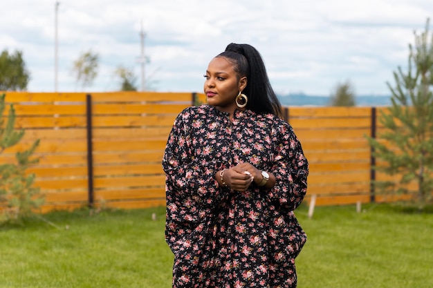 Portrait of beautiful african american woman having fun on village or suburbian outdoor portrait of