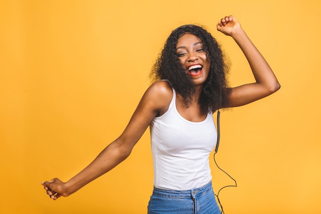 Portrait of beautiful african american woman listening music