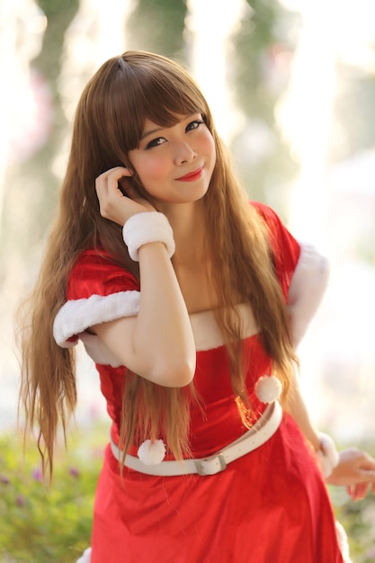 Portrait of beautiful Asian female santa in Christmas