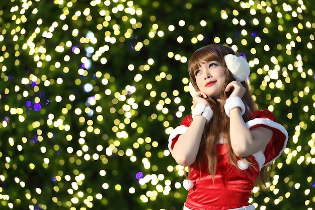 Portrait of beautiful Asian female santa in Christmas