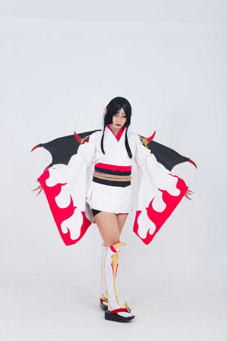 Photo portrait of beautiful asian girl wear cosplay game animation on white backgroundthailand peoplered cloths devil style