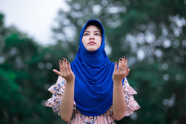 Portrait of beautiful asian girlYoung muslim woman prayer