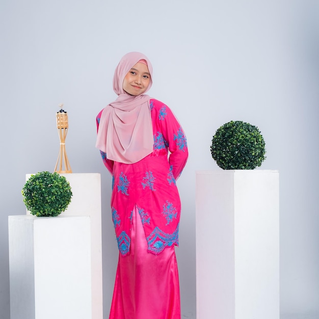 Portrait of a beautiful Asian Muslim female model wearing hijabwear with at a studio photoshoot