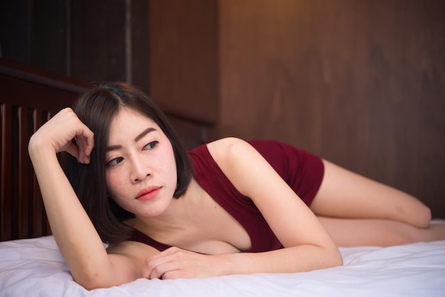 Portrait of beautiful asian sexy woman in the bedroomThailand peoplePose for take a picture