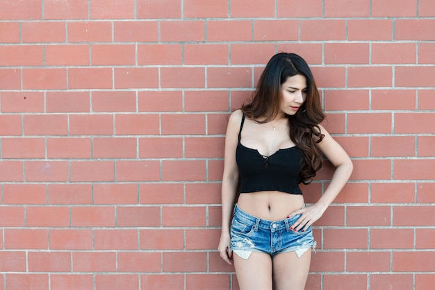 Portrait of beautiful asian woman on brick wall backgroundThailand people