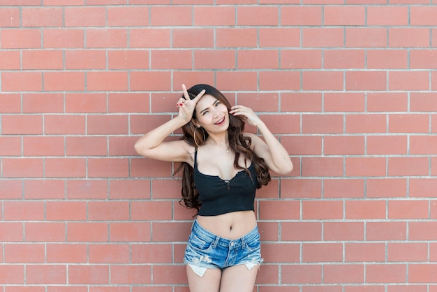 Portrait of beautiful asian woman on brick wall backgroundThailand people