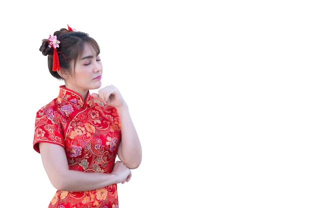 Portrait beautiful asian woman in Cheongsam dress on white backgroundThailand peopleHappy Chinese new year conceptHappy asian lady in chinese traditional dress