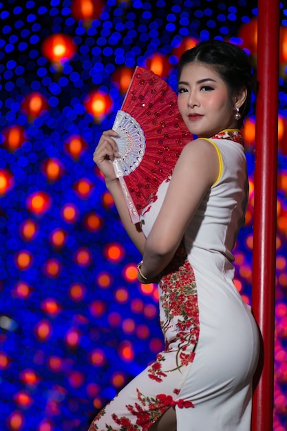 Portrait beautiful Asian woman in Cheongsam dress