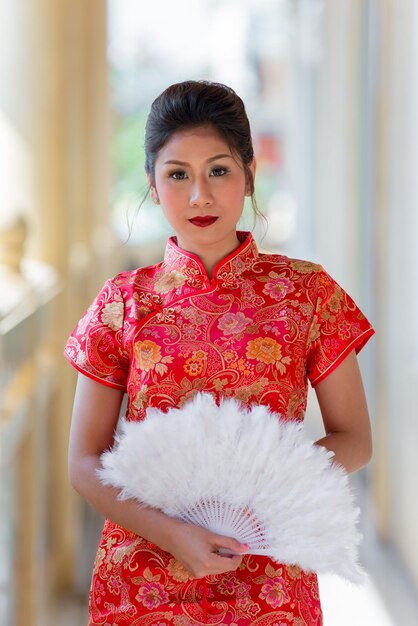 Portrait of beautiful asian woman in Cheongsam dressThailand peopleHappy Chinese new year concept