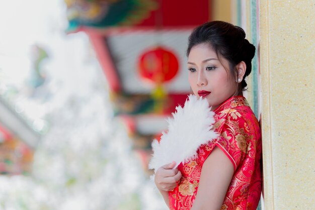 Portrait of beautiful asian woman in Cheongsam dressThailand peopleHappy Chinese new year concept