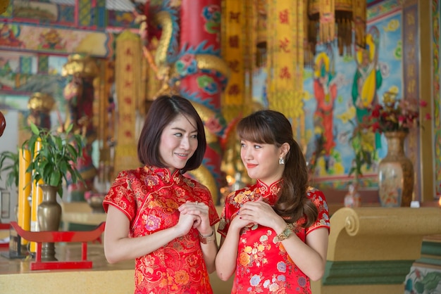 Portrait of beautiful asian woman in Cheongsam dressThailand peopleHappy Chinese new year concept