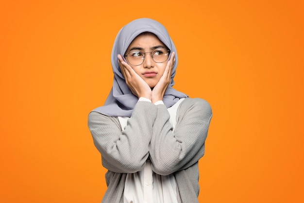 Portrait of beautiful Asian woman feeling bored and looking up