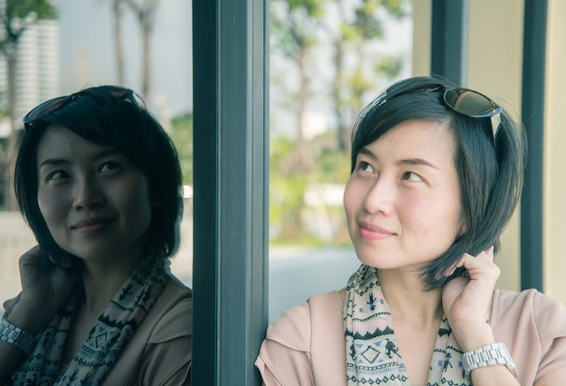 Portrait of beautiful Asian woman in the park