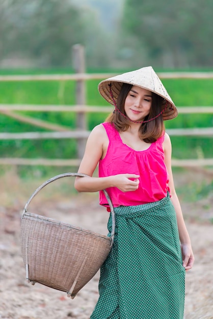 Portrait of beautiful asian woman wear countryside dress of thai at the fieldThailand people