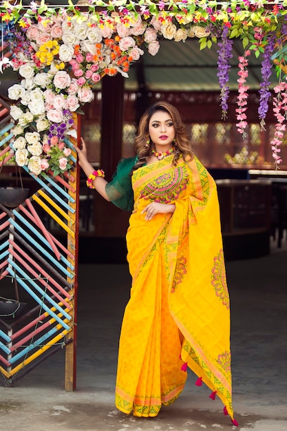 Portrait of beautiful Asian women wearing yellow saree