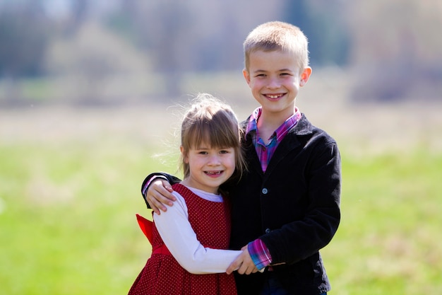 Portrait of beautiful blond smiling children