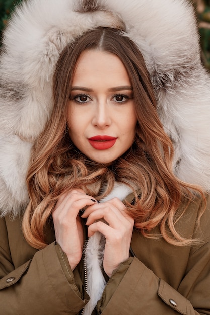 Portrait of beautiful blond woman dressed in warm clothes